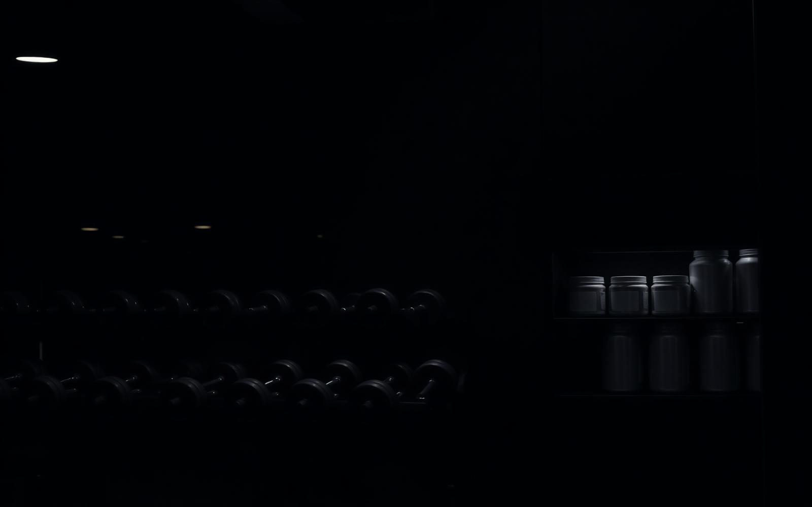 Dark gym interior with dumbbell racks and unbranded supplement containers